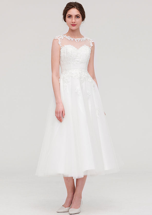 Enchanting A-Line/Princess Tulle Wedding Dress with Illusion Neck, Sleeveless Design, Tea-Length, and Appliqued Beading