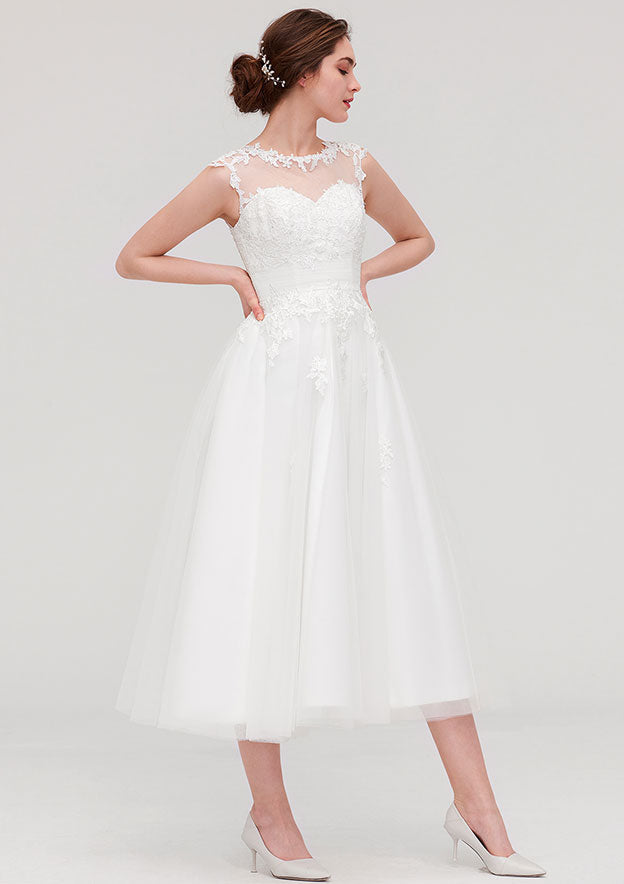 Enchanting A-Line/Princess Tulle Wedding Dress with Illusion Neck, Sleeveless Design, Tea-Length, and Appliqued Beading