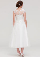 Enchanting A-Line/Princess Tulle Wedding Dress with Illusion Neck, Sleeveless Design, Tea-Length, and Appliqued Beading